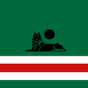 A black wolf silhouette lying down beneath a black circle on a horizontal green, white, and red flag.