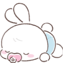 A small white bunny wearing a diaper and a pacifier sleeping peacefully.