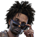 A man with textured hair peering over the top of his sunglasses with a suspicious and judgmental expression.