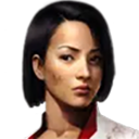 Woman with short dark hair and a serious, intense expression looking directly forward.