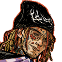 A man with dreadlocks and facial tattoos wears a black beanie while giving a smug, sideways smirk.