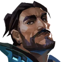 A man with a dark beard and hair looks down with a smug, confident expression.