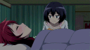 Two anime girls in bed, with one leaning in to kiss the other on the cheek.