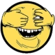 A yellow smiley face with its hands covering its eyes, peeking through its fingers with a wide, toothy, mischievous grin.