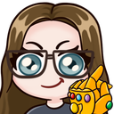 A cartoon woman with glasses wearing a golden gauntlet with colorful gems, looking smug.