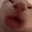 Cat face looking distorted and confused in a close-up shot.