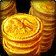 A stack of shiny gold coins against a dark background.