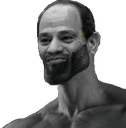 Man with an extremely angular jawline looking forward with a confident and stoic expression.