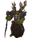 A green-skinned warlock in a brown hooded robe stands holding a staff with skulls floating above his shoulders.