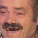 El Risitas laughing with a wide, toothless grin and crinkled eyes.
