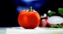 person_cuts_tomato