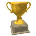 Gold trophy standing on a gray stone pedestal.