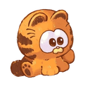 A tiny orange tabby kitten sitting with large, wide eyes and a confused expression.