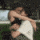 A couple is shown in an animated sequence hugging each other tightly.