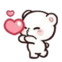 A small white bear blowing a pink heart-shaped kiss towards the viewer.