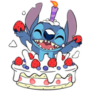 Stitch the blue alien smiling widely while emerging from a strawberry cake with a lit candle on his head.