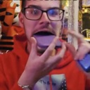A person wearing glasses and a red hoodie holds a purple smartphone to their mouth as if biting it.