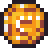 A small pixelated gold coin with brown shading and white highlights.