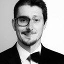 Man with a split face showing one side with glasses and the other side in a tuxedo.