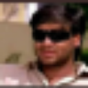 A man wearing dark sunglasses looking cool and mysterious.