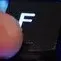 F_