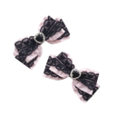 Two black lace bows with small heart charms arranged diagonally.