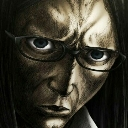 A person with glasses staring intensely with a suspicious and judgmental expression.