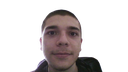 A young man with a neutral, deadpan expression looking directly at the camera in a close-up selfie.