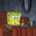 SpongeBob SquarePants sitting at a booth looking nervous and anxious.