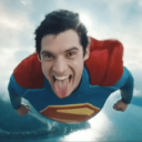 Superman flying forward with a mischievous grin and his tongue sticking out.