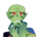 Green alien with red eyes looking disgusted while holding its hands to its face.