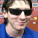 Lionel Messi wearing dark sunglasses with a slight, confident smirk.