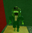 A low-poly green creature with a wide open mouth and a long tongue, looking like a distorted 3D character.