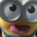 Minion with goggles sticking its tongue out in a silly expression.