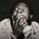 Person with wide eyes and hands covering their mouth in a shocked expression.