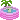 A small green frog swims back and forth inside a circular pink inflatable pool with a tiny palm tree attached.