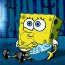 SpongeBob sits and eats popcorn from a blue bowl while watching something.