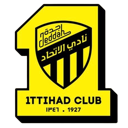 Ittihad Club crest featuring a yellow shield with black stripes and text.