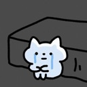 A small white cat-like creature with blue tears streaming down its face, huddling in a dark corner.
