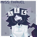Miss Thavel with dark hair and a smug grin wearing alphabet blocks on her head.