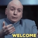 Dr. Evil makes a sarcastic welcoming hand gesture with the word WELCOME in yellow text below.