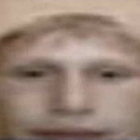 Human face with a heavily distorted and stretched expression looking directly at the viewer.
