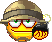 A pixelated yellow smiley face wearing a brown helmet and holding a black ticking bomb.