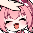 Anime girl with pink hair smiling brightly while receiving a gentle headpat from a hand.