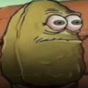 A brown nut with large, wide, bloodshot eyes looking off to the side with a blank expression.