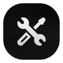 A white wrench and screwdriver crossed over each other on a dark background.