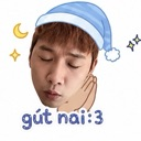 Person with eyes closed wearing a blue nightcap with the text gút nai:3 below.