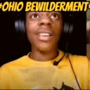 Man wearing headphones and a yellow shirt looking at the camera with a shocked and confused expression.