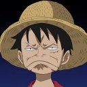 Monkey D. Luffy wearing a straw hat with a deeply grumpy and aged facial expression.