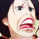 Woman with dark hair making an extremely shocked expression with a wide-open mouth.